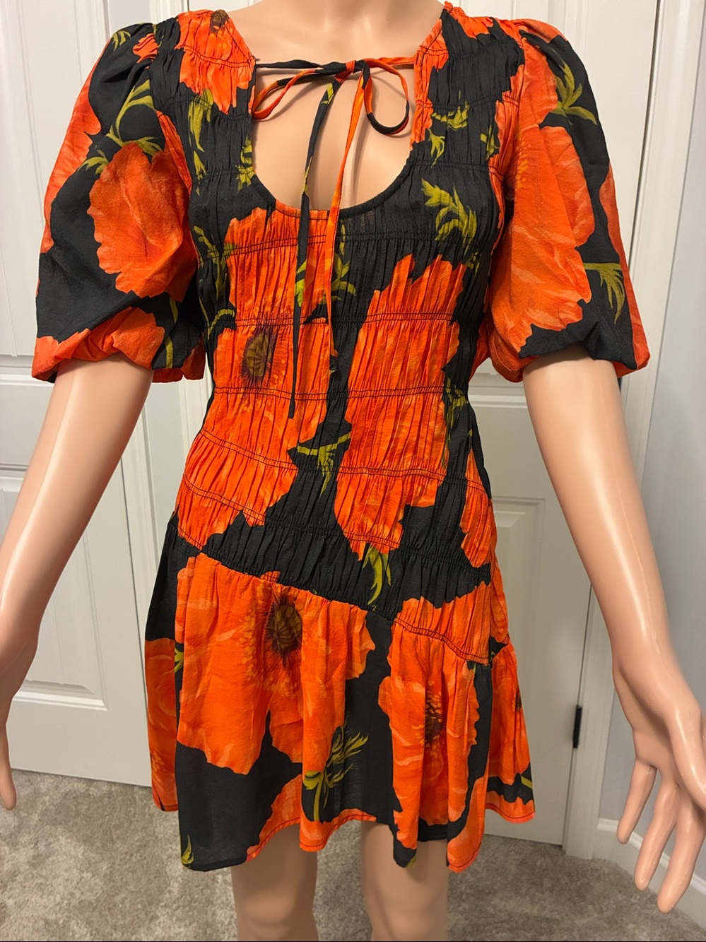 Black Mini Dress with Bold Orange Floral Print by Never Fully Dressed.